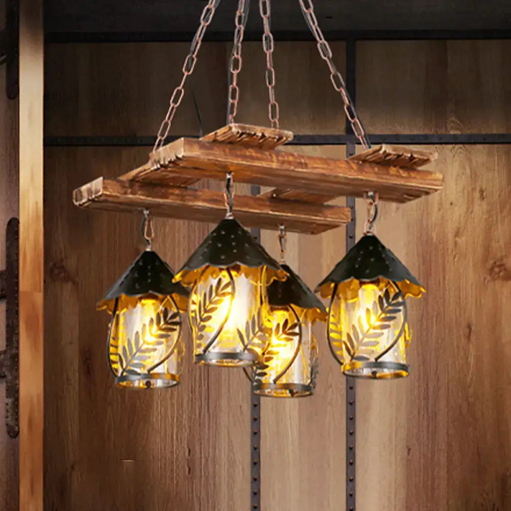 Rustic wooden chandelier with three clear glass lanterns, white fabric shades, metal arm, and warm yellow lighting