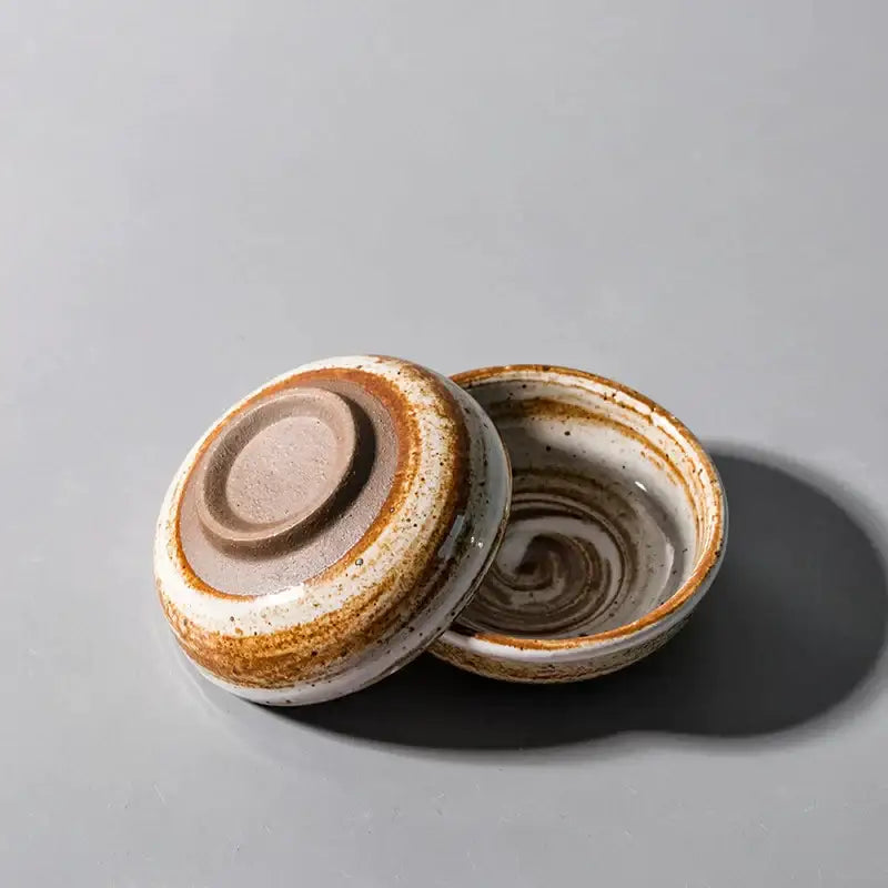 Rustic white speckled handcrafted ceramic seasoning sauce dish with lidded bowl and earthy swirling brown and white glaze decorbites ceramic seasoning