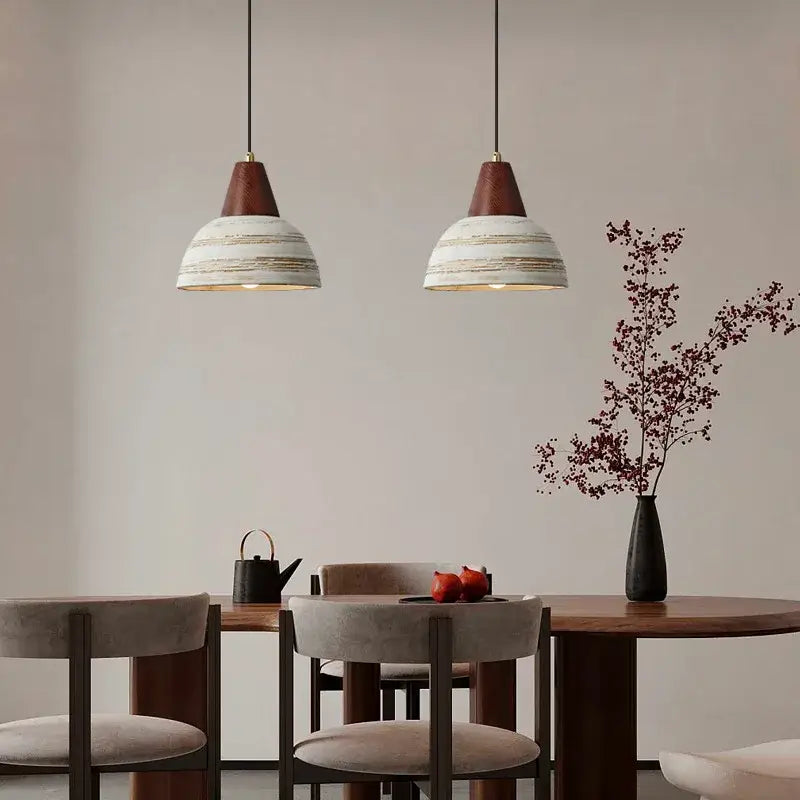Two rustic white ceramic wood pendant lights with distressed shades hanging from black cords for kitchen decorbites ceramic wood led lighting