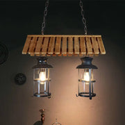 Rustic wood and black antique cylinder island lamp with wooden slat pendant and two black lanterns for kitchen lighting
