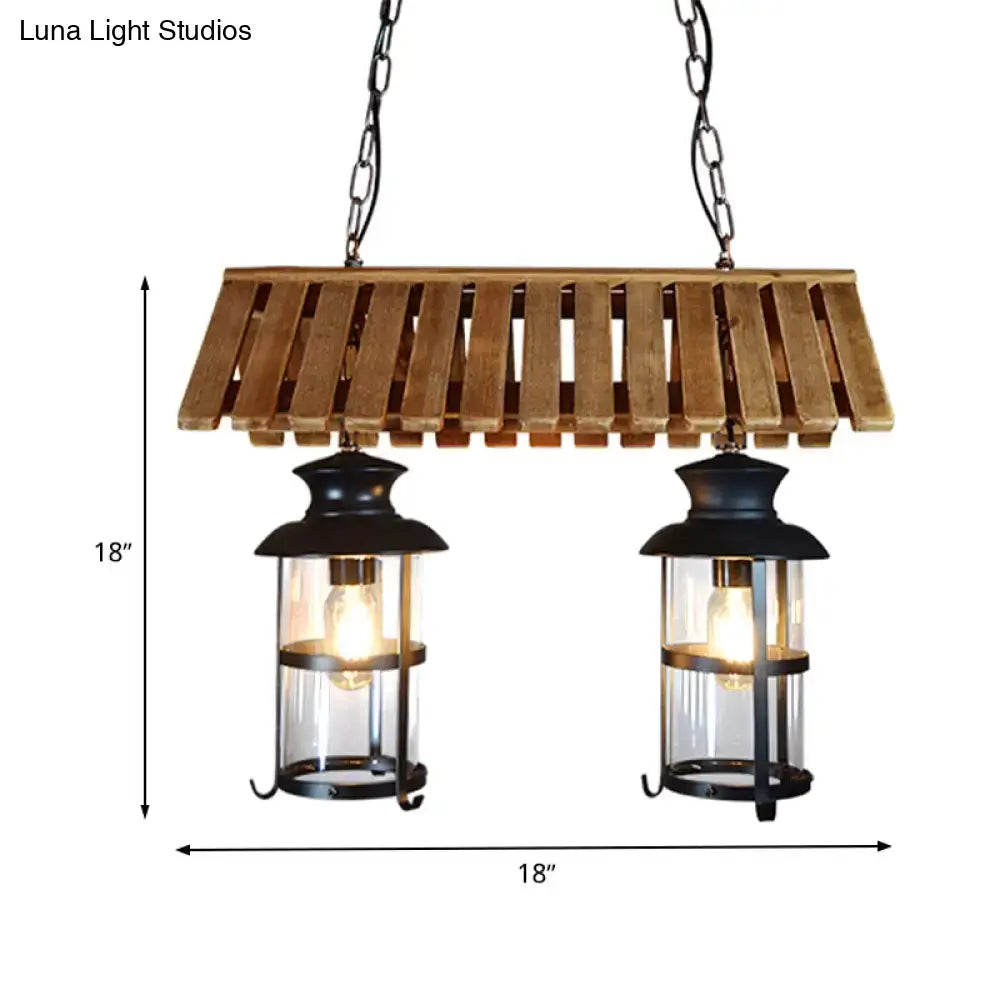 Rustic wood and black antique cylinder island lamp with wooden slats and clear glass panels for kitchen lighting