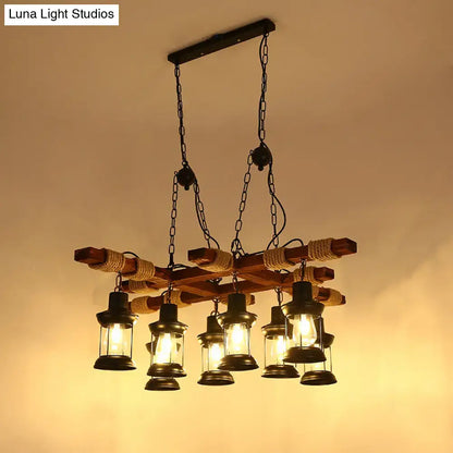 Rustic farmhouse brown lantern pendant lamp with black metal lanterns rope accents and clear glass wood arms
