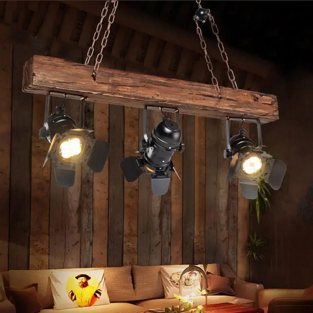 Rustic wood and black metal 3 light island pendant kitchen light with wooden beam and three black industrial spotlights