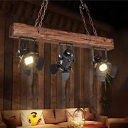 Rustic wood and black metal 3 light island pendant kitchen light with wooden beam and three black industrial spotlights