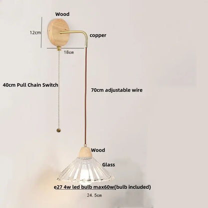 Rustic wood and brass wall light with clear glass pendant and pull chain switch featuring fluted faceted design