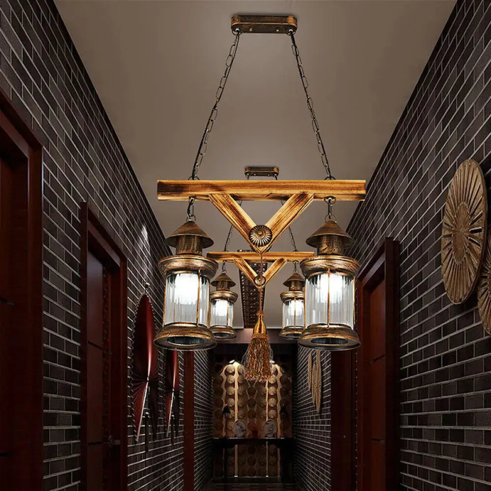 Rustic wooden chandelier with brass lanterns and glass panels in decorbites™ bronze coastal 4-light island light fixture