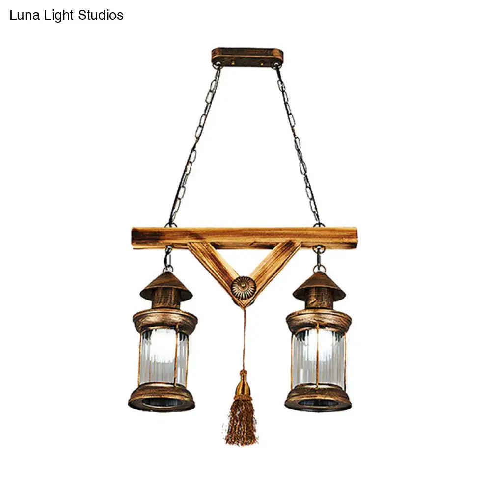 Antique brass 4-light island light fixture with clear glass panels and wooden crossbar by DecorBites bronze coastal