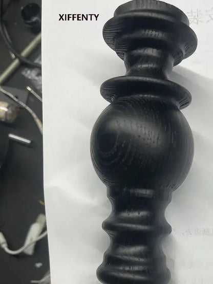 Black wooden candlestick with polished turned design and visible grain suitable for decorbites led wood wall light decor