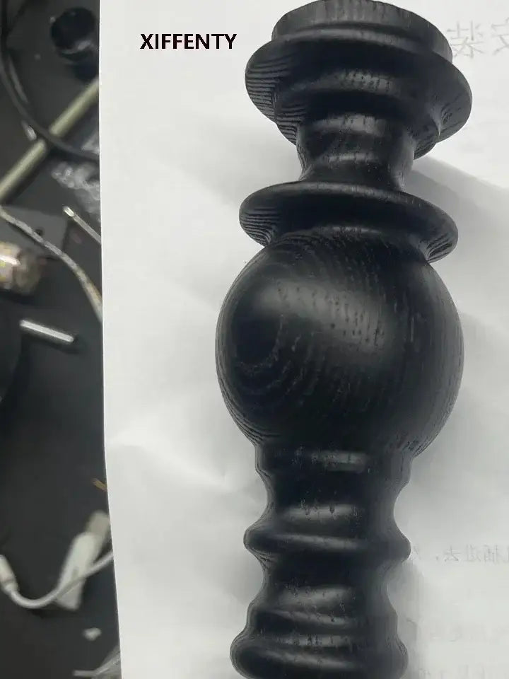 Black wooden candlestick with polished turned design and visible grain suitable for decorbites led wood wall light decor