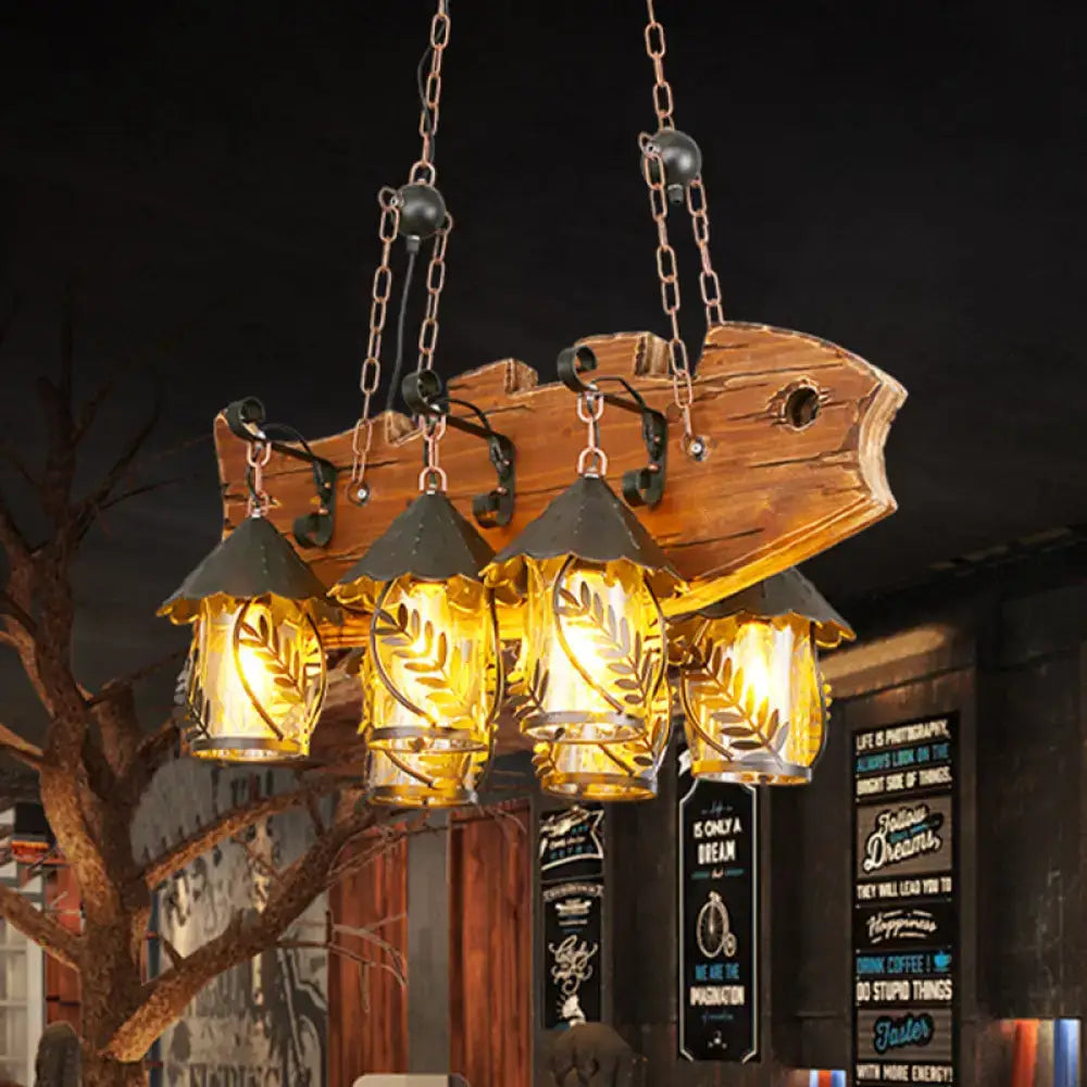 Rustic wood and glass dining room chandelier with four amber glass lanterns leaf etched and black metal arm island lamp