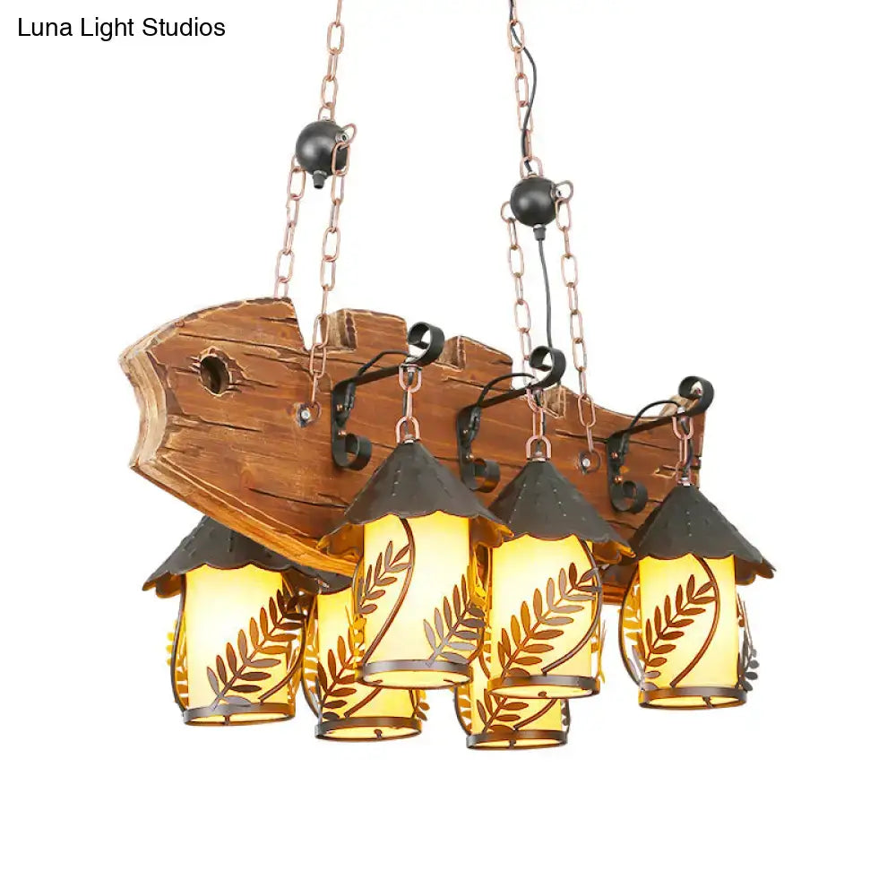 Rustic wood and glass dining room chandelier with three amber lanterns leaf etched and black metal arm island lamp