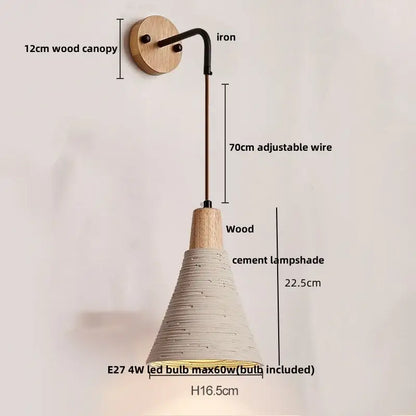 Rustic wood and gray wall light fixture with natural wood canopy, black iron arm, and textured off-white cement shade