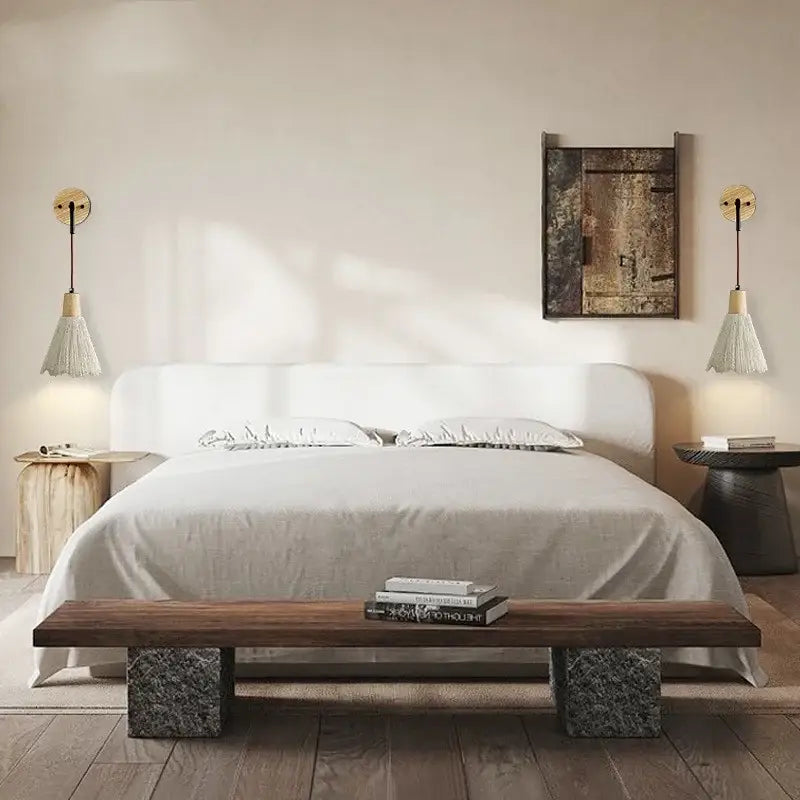 White upholstered bed with sleek modern design paired with rustic wood and gray wall light fixture bedroom sconce with pull chain