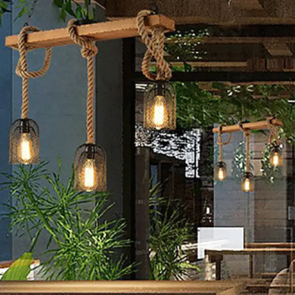 Rustic wooden beam pendant light with thick braided rope suspension and clear glass lampshades for industrial decor