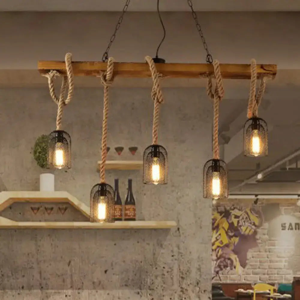 Rustic wooden beam chandelier with thick natural rope suspending five black metal mesh pendant light cages