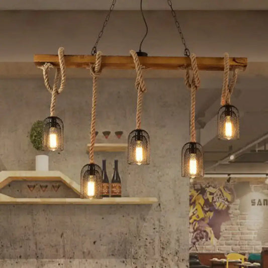 Rustic wooden beam chandelier with thick natural rope suspending five black metal mesh pendant light cages