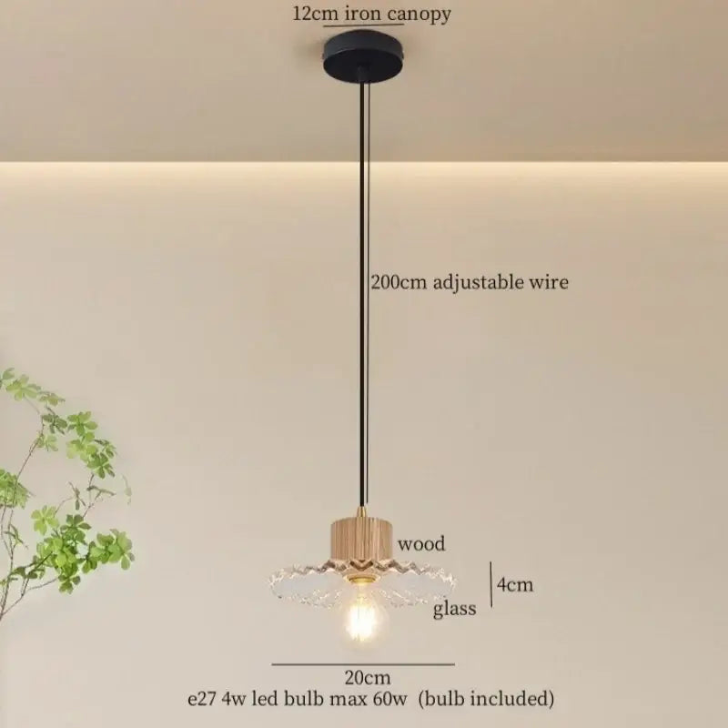 Rustic wood and ribbed glass led pendant light with black iron canopy and exposed bulb for dining room lighting