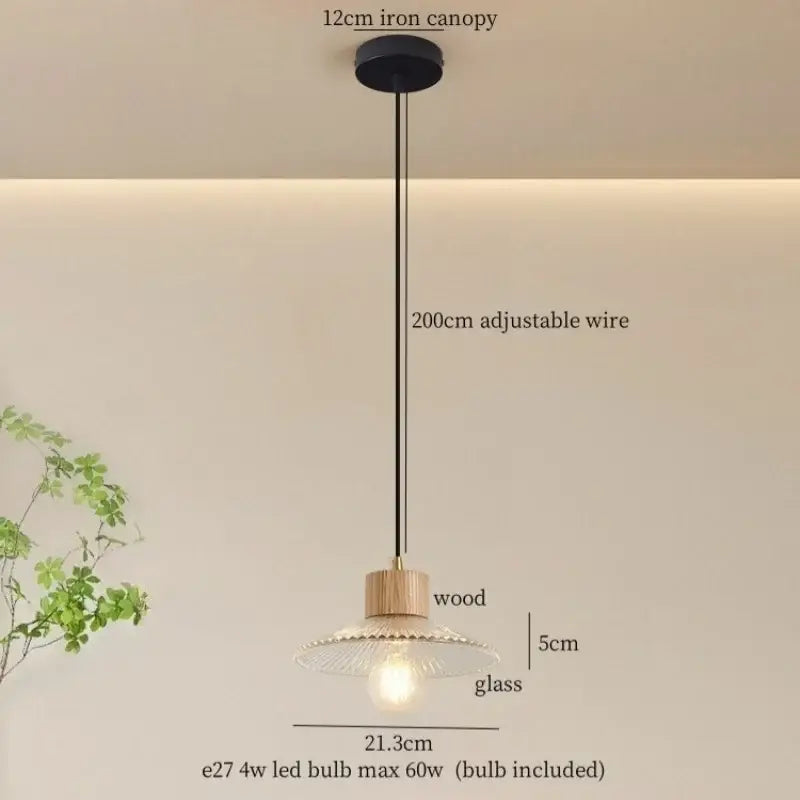 Rustic wood and ribbed glass led pendant light with black iron canopy and adjustable wire for dining room lighting
