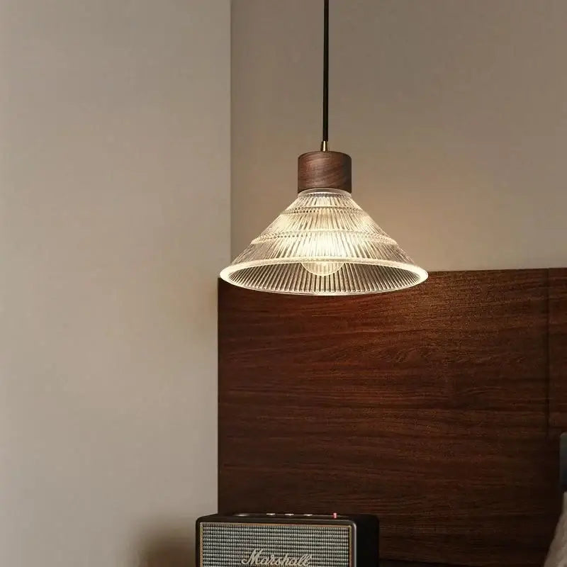 Rustic wood and warm-toned ribbed glass led pendant light with black cord for dining room use