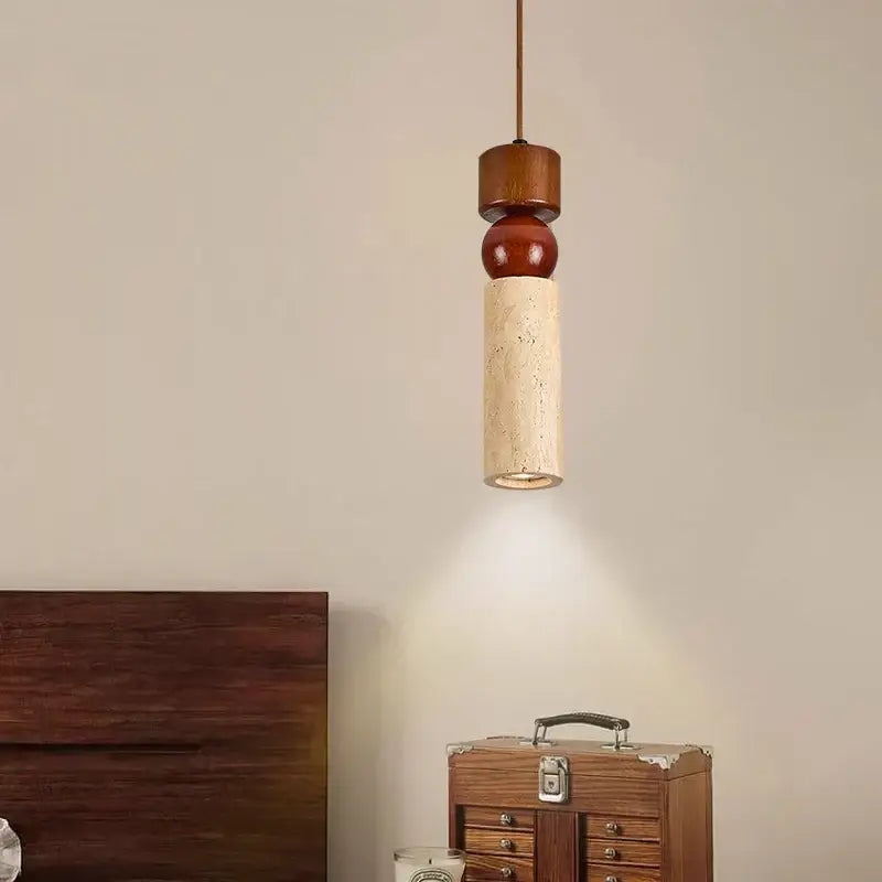 A modern rustic wood and travertine pendant lamp with columnar stone led and reddish-brown wooden spheres