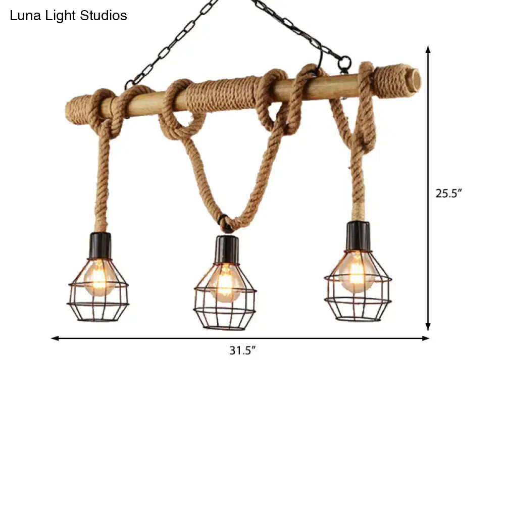 Decorbites vintage black metal island light with three caged bulbs, natural wood beam and rope ties for dining room