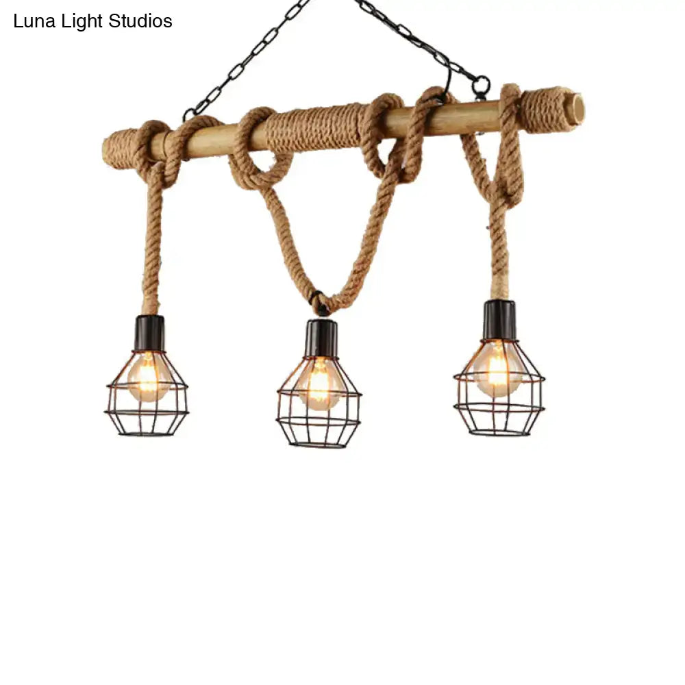 DecorBites™ vintage black metal island light with three caged bulbs, natural wood beam, and rope knots for dining room