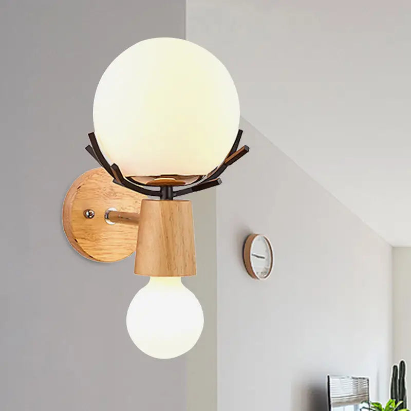 Rustic wall lamp featuring a white globe sconce with frosted glass on dark metal branches and wooden base for stairways