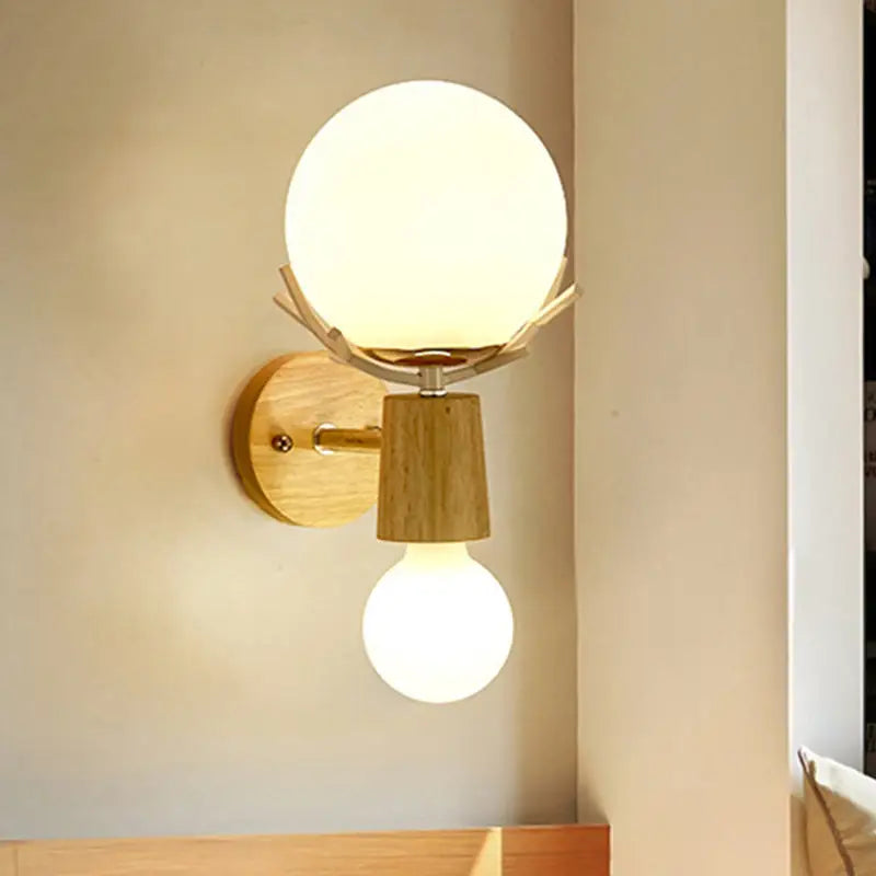 Rustic wood wall lamp with warm tones and white globe sconce featuring frosted glass and exposed bulb for stairways