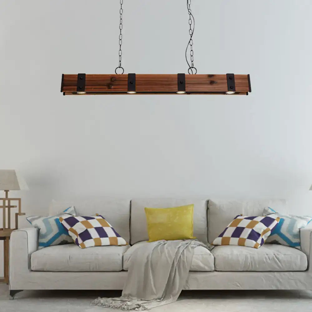Rustic wooden beam pendant light with black finish metal accents and four embedded lights for kitchen island lighting