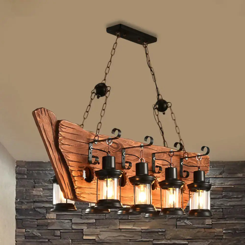 Rustic wooden boat-shaped chandelier with industrial black lanterns and clear glass shades for dining room lighting