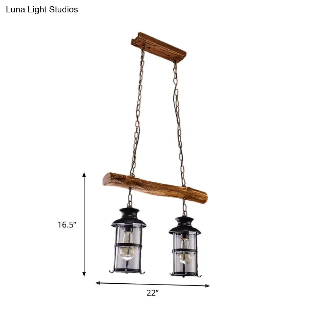 Rustic two-lamp hanging lantern chandelier with wood design and clear glass in black metal frame by DecorBites brown finish
