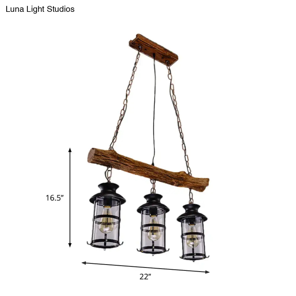 Rustic wooden beam chandelier with three black lantern-style lights featuring wood design and clear glass elements
