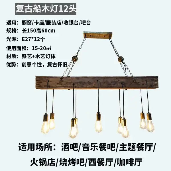 Rustic wood hanging chandelier with twelve brass edison bulbs on weathered wood beam and iron chains for bar hanging chandeliers