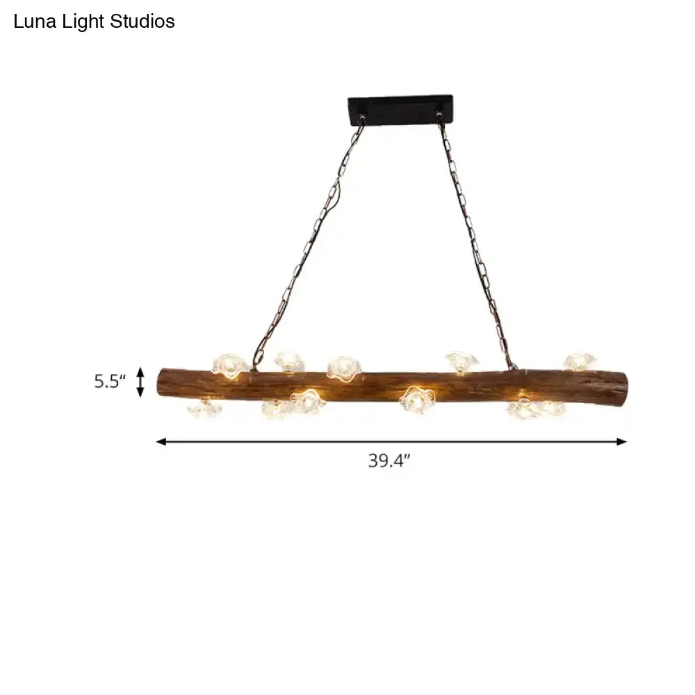Rustic wood log hanging lamp with clear glass globe bulbs and black metal chains for kitchen chandelier lighting