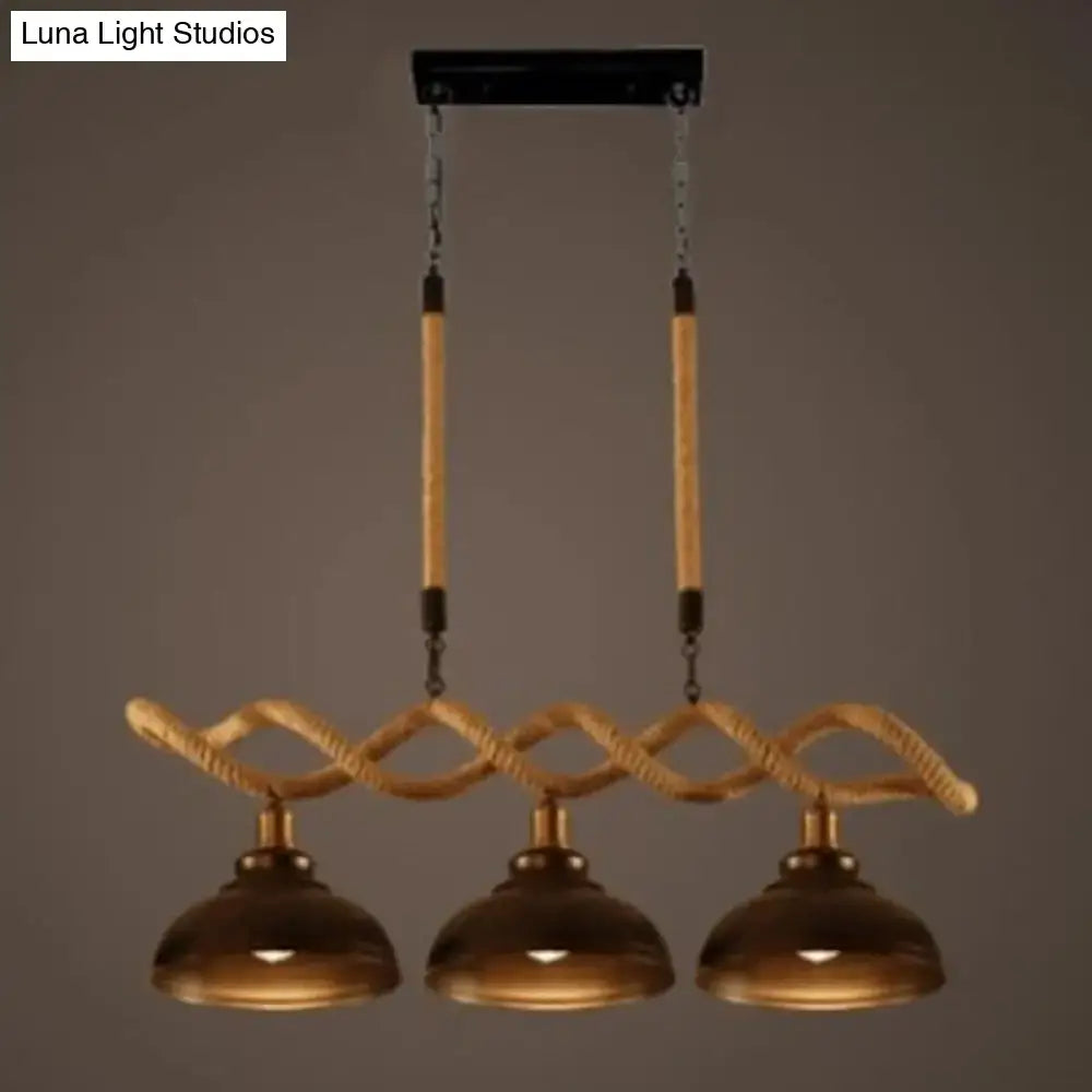 Rustic wooden beam three-light island pendant kitchen light with brass dome shades and beige twisted rope detailing