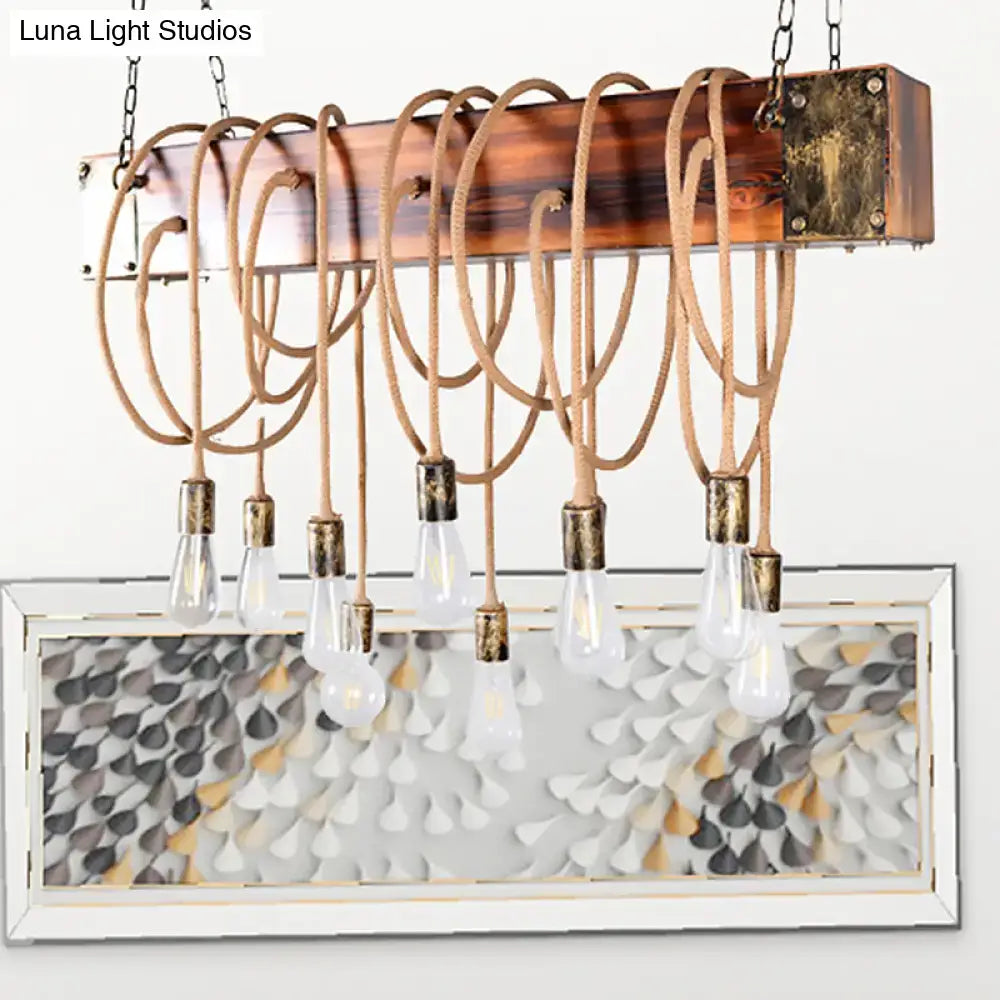 DecorBites rustic metal island chandelier with wooden beam, braided rope cords, clear bulbs, and black antique brass fittings