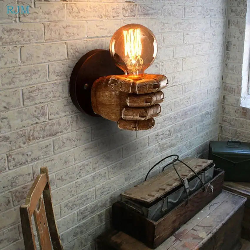 Rustic wooden hand model wall lamp with glowing filament bulb designed as wall lamps for vintage living room decor
