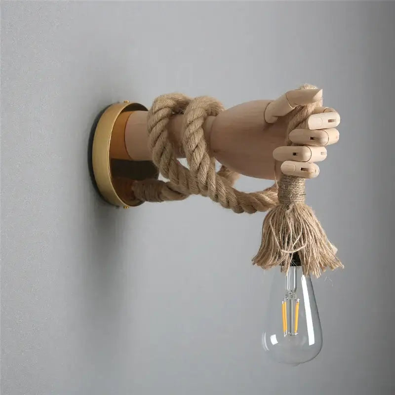 Rustic wooden hand shape hemp rope wall light with beige rope and edison bulb on brass plate for restaurant corridor