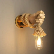 Rustic wooden hand shape hemp rope wall light with beige rope and exposed filament bulb for restaurant corridor