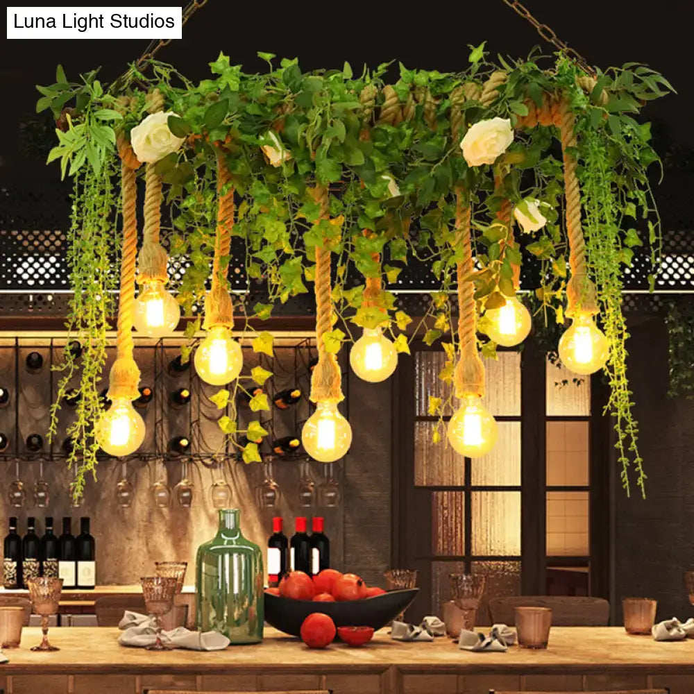 Rustic wooden island light fixture with exposed bulbs hanging by twisted rope and decorative vines for dining room