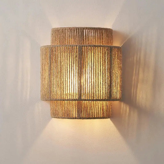 Warm-toned tiered wall lights crafted from woven natural hemp rope with a textured rustic finish by decorbites