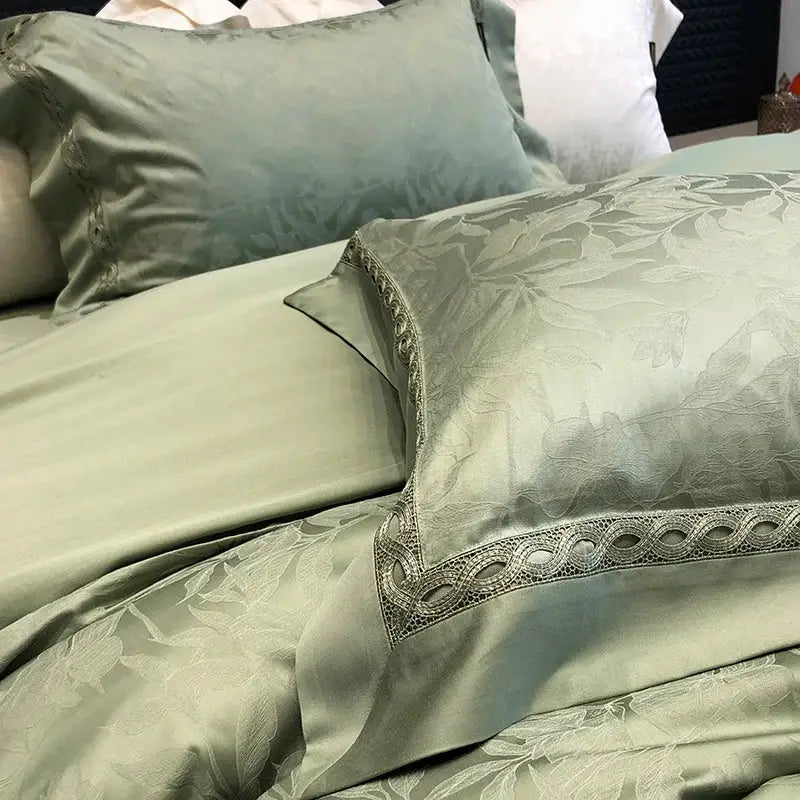 Sage green silk pillowcase with subtle leaf pattern and silver lace trim in decorbites 1000tc lyocell cotton bedding set