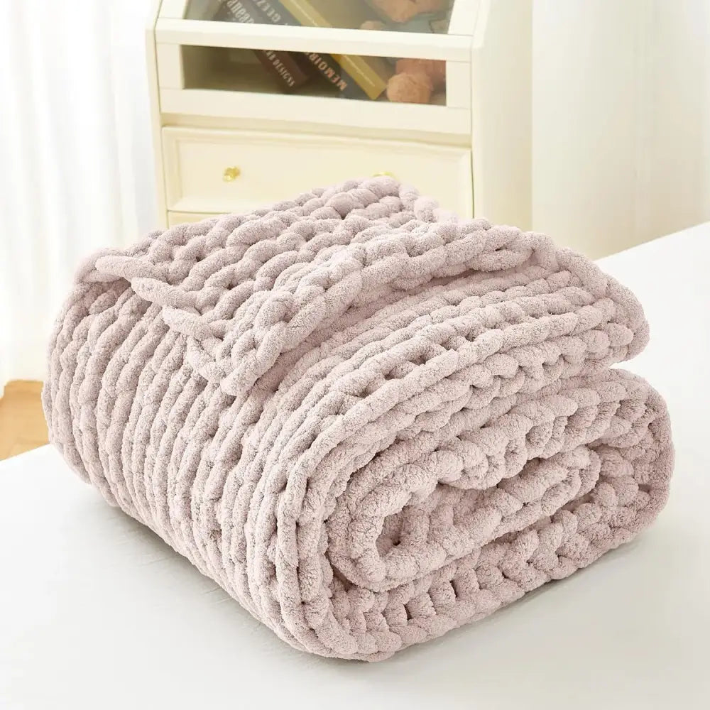 A plush light mauve chunky knit fleece blanket with a soft textured surface from decorbites cozy autumn fleece collection
