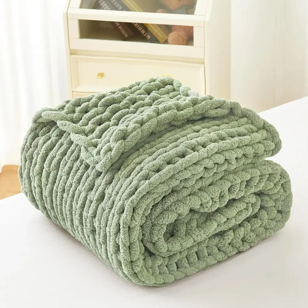 A sage green chunky knit fleece blanket with a plush textured surface from decorbites cozy autumn fleece collection