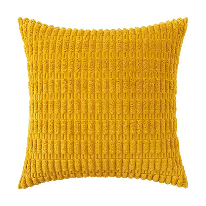 A vibrant mustard-yellow throw pillow with textured ribbed corduroy fabric from a sage green corduroy velvet pillowcase set