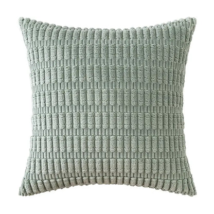A soft sage green corduroy velvet throw pillow with a textured ribbed pattern from a pillowcase set of 2
