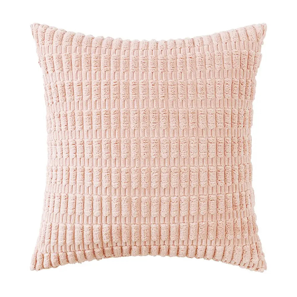 A soft blush pink pillow with a textured woven corduroy velvet pattern in a sage green corduroy pillowcase set
