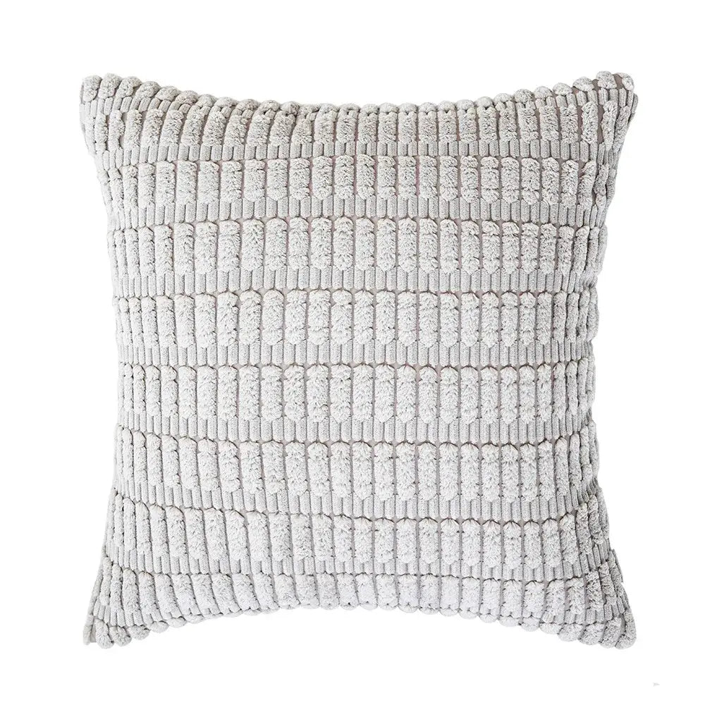 A soft light gray textured throw pillow with woven ribbed pattern in a sage green corduroy velvet pillowcase set