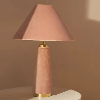A soft pink velvet floor lamp with tapered conical shade and gold-toned metal accents by decorbites cotton velvet
