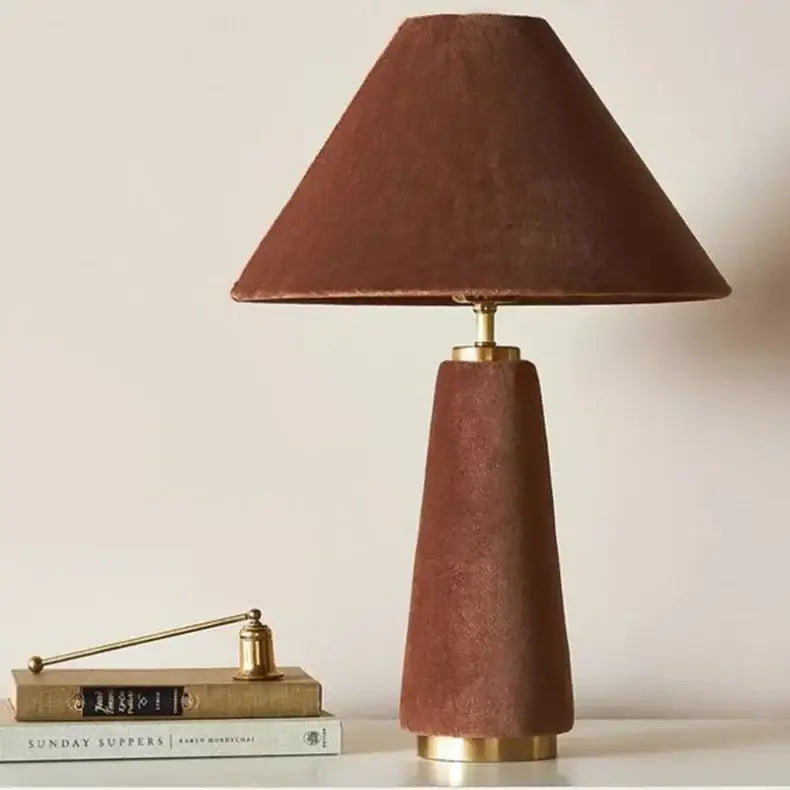A terracotta floor lamp with suede shade and brass accents complements cotton velvet decorbites living room light